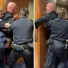Tangkapan layar menunjukkan Brian McGinnis diseret keluar dari sidang Senat.