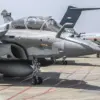 Presiden Prabowo Subianto memercikkan air pada jet tempur Rafale sebagai bagian dari upacara penyerahan di Jak